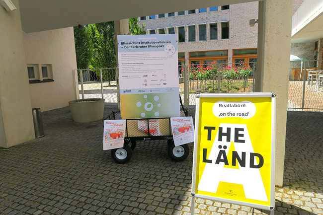 Schild am Eingang zur Reallabor-Tagung "Reallabore on the Road" in Stuttgart.